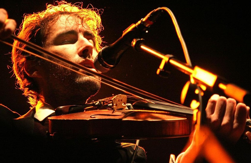 Andrew Bird with violin in concert